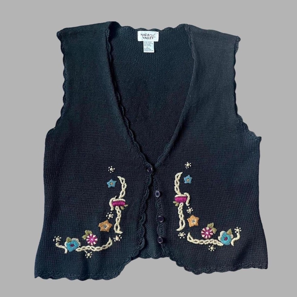 crocheted cottagecore sweater vest with embroidered flowers and purple buttons